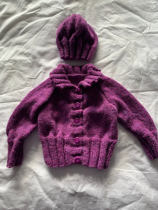 Mauve purple colour cardigan with 5 buttons with a matching hat