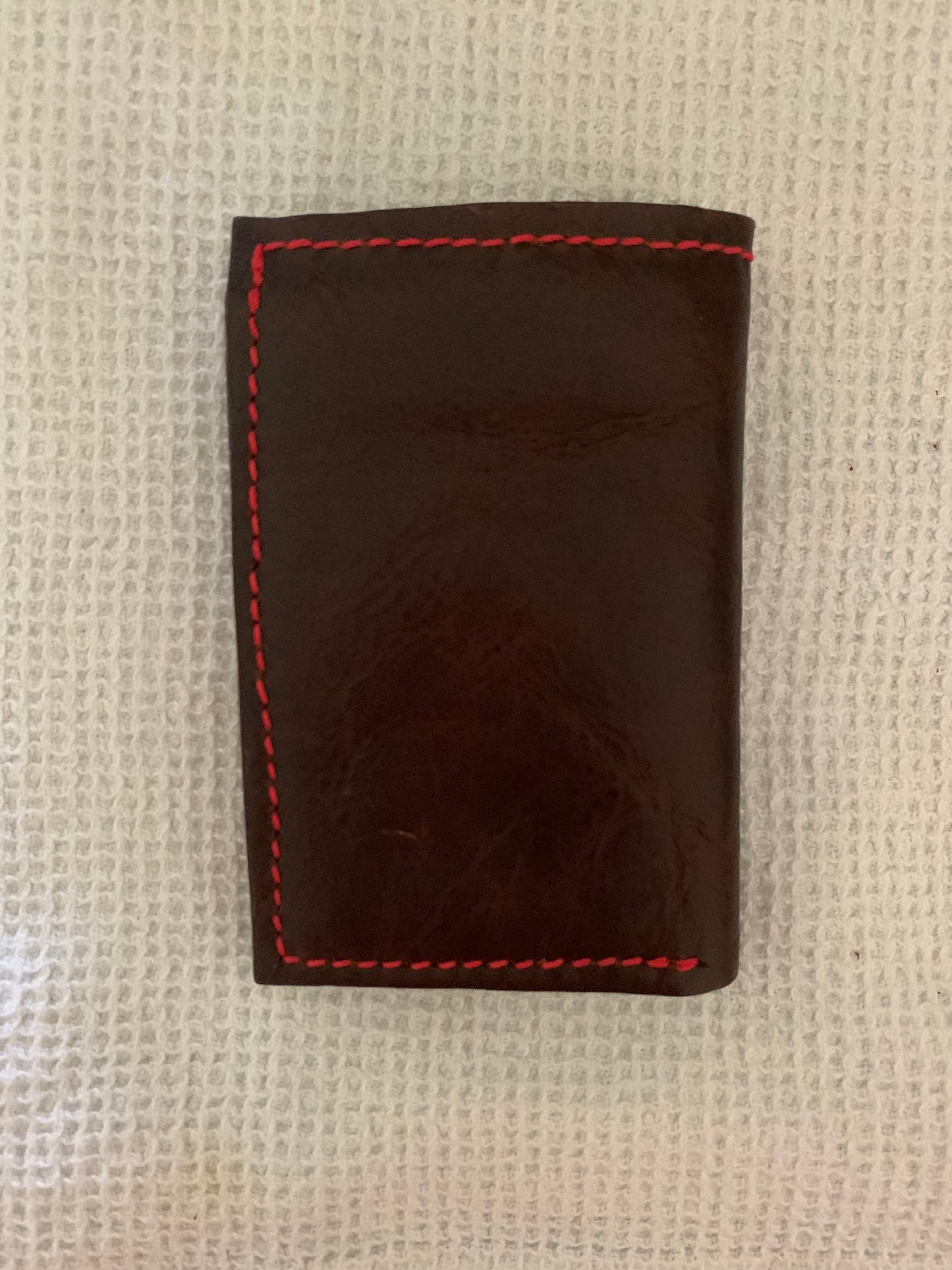 Dark brown outer leather vertical bifold