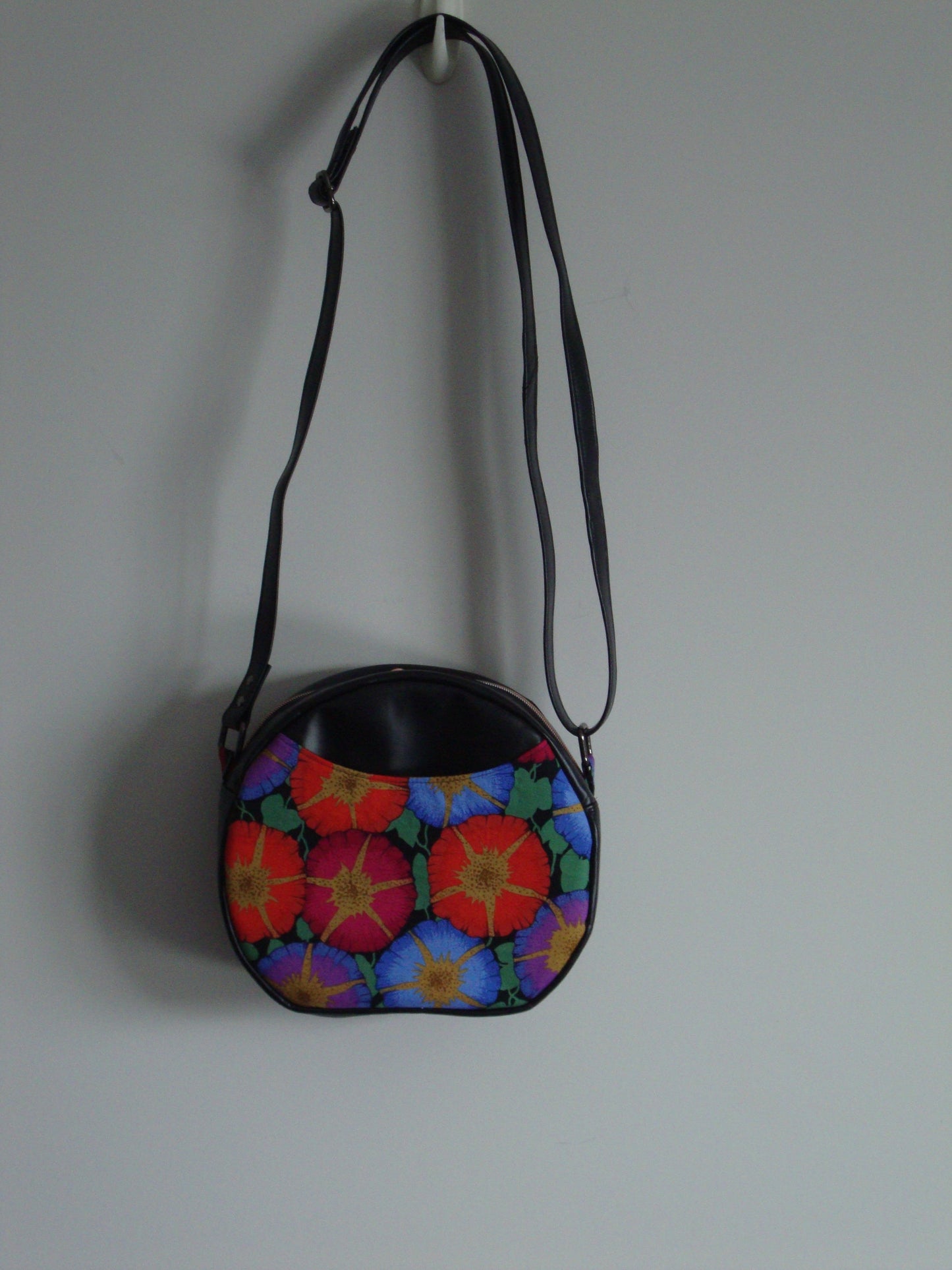 Multi Coloured Flowers with Black Vinyl Flat Bottom Circular Crossbody Bag