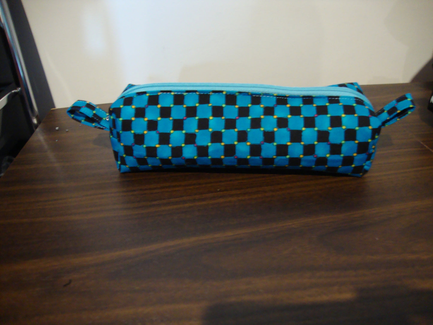 dark blue and black checkered pencil case