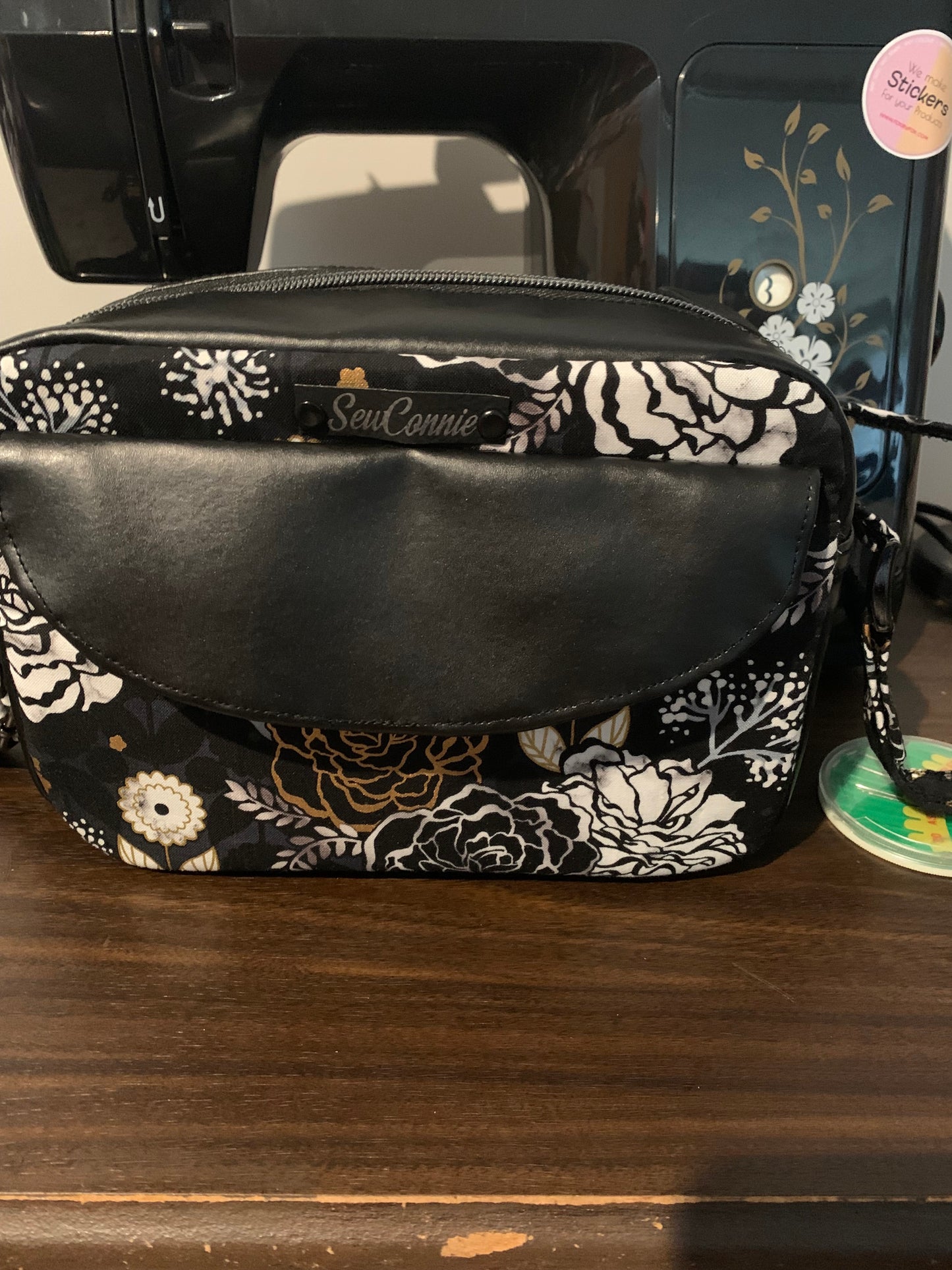 Black and white roses with black vinyl rectangle shaped crossbody bag